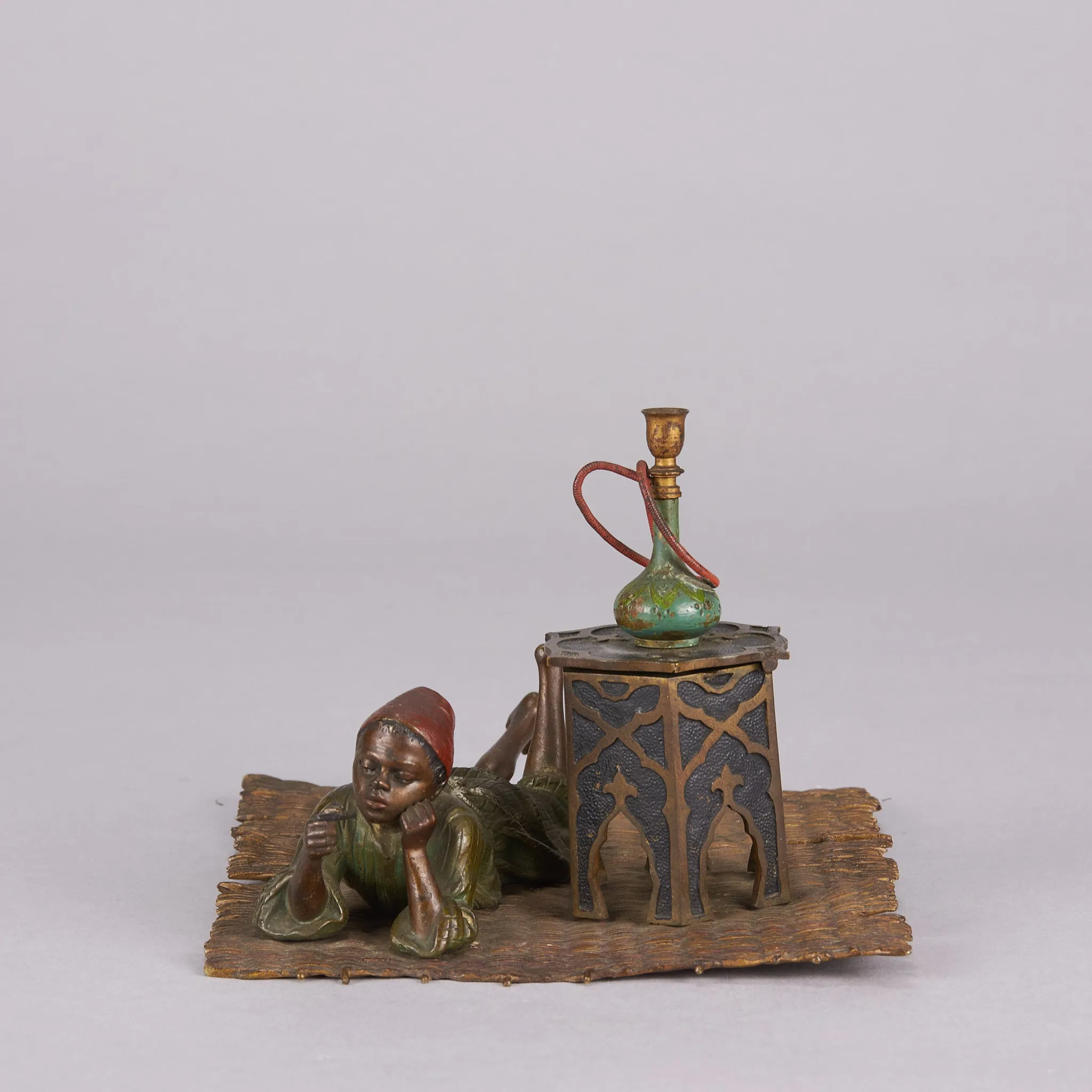 "Boy on Rug Inkwell" by Franz Bergman