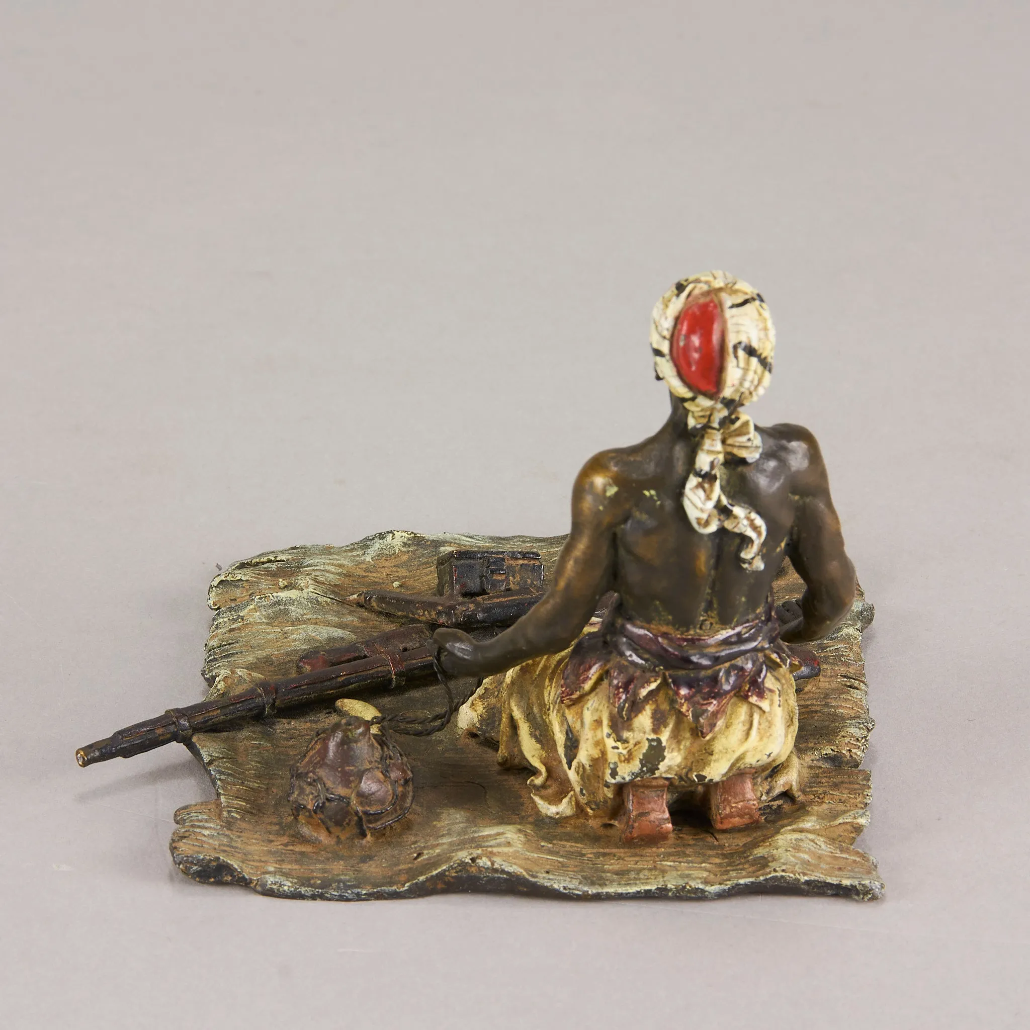 "Seated Arms Dealer" by Franz Bergman
